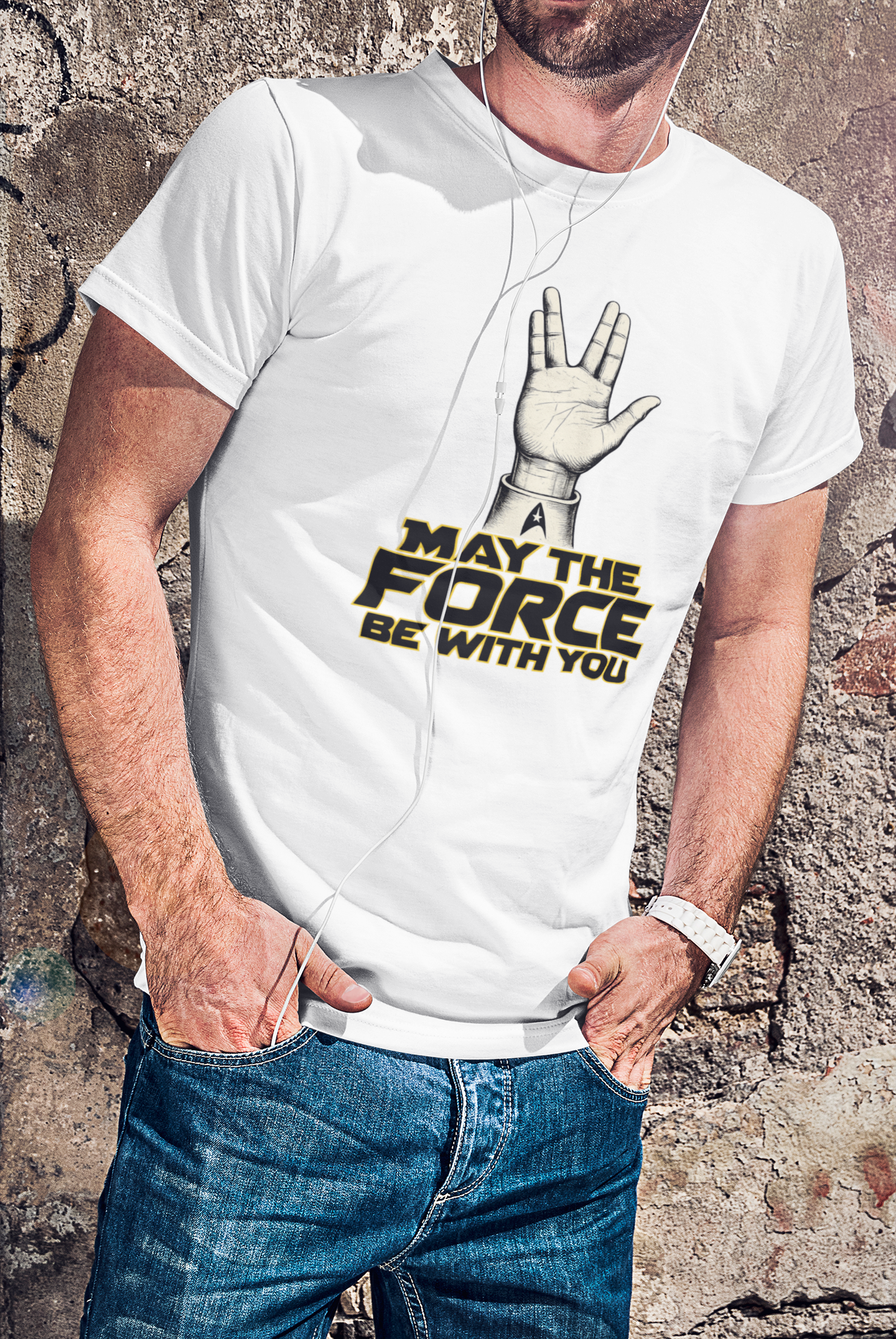 Person wearing a white t-shirt with a Star Wars-themed design against a textured wall.